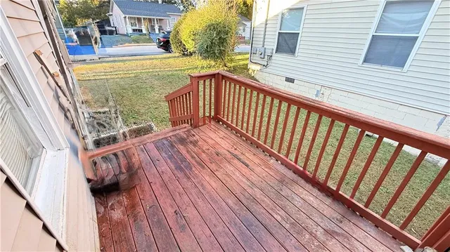 a view of balcony with wooden floor