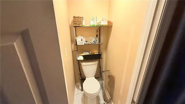 a bathroom with a toilet and a sink