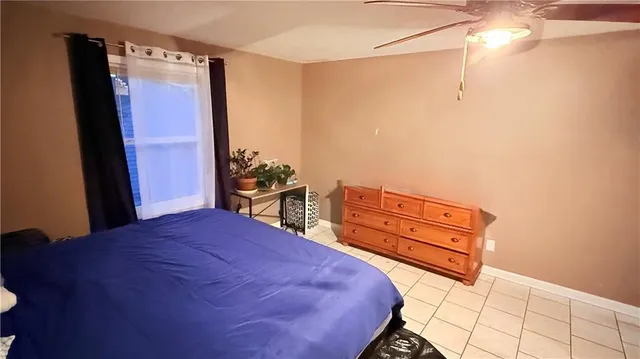 a bed room with a bed and a dresser