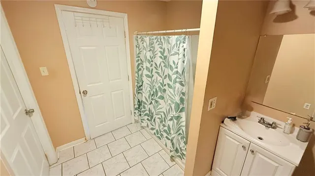 a bathroom with a sink and a shower