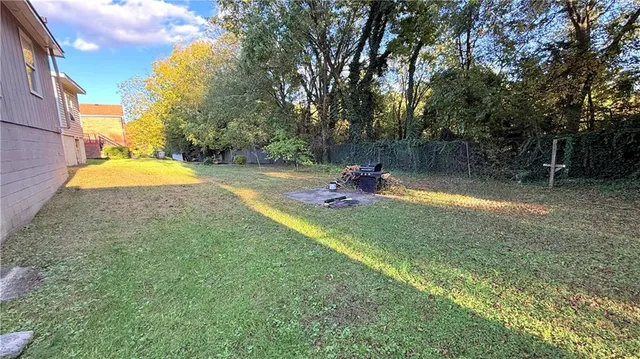 a view of a park with large trees