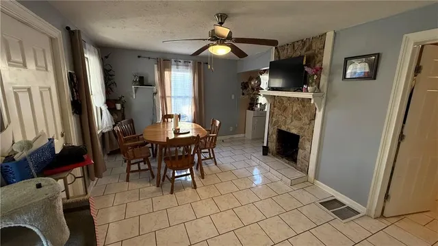 a view of a livingroom with furniture and a fireplace