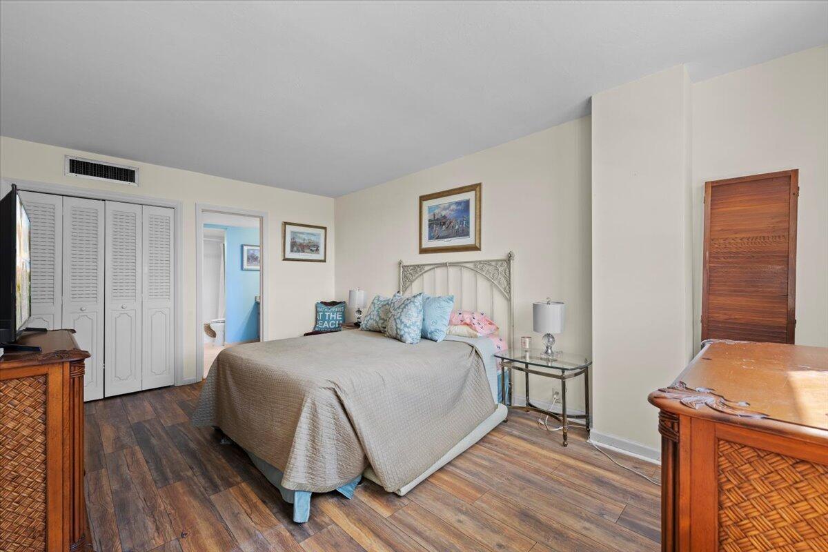 1200 Marine Way, Unit 304 North Palm Beach, FL 33408 - Photo 15 of 31 a bedroom with a bed and a flat screen tv