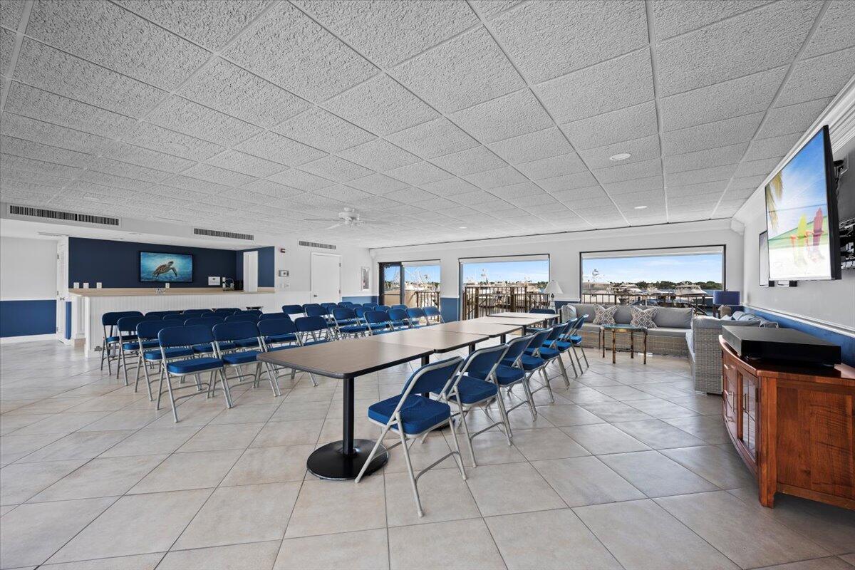 1200 Marine Way, Unit 304 North Palm Beach, FL 33408 - Photo 21 of 31 a room with lots of wooden furniture and glass windows