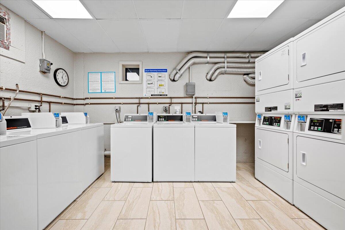 1200 Marine Way, Unit 304 North Palm Beach, FL 33408 - Photo 22 of 31 a utility room with cabinets washer and dryer