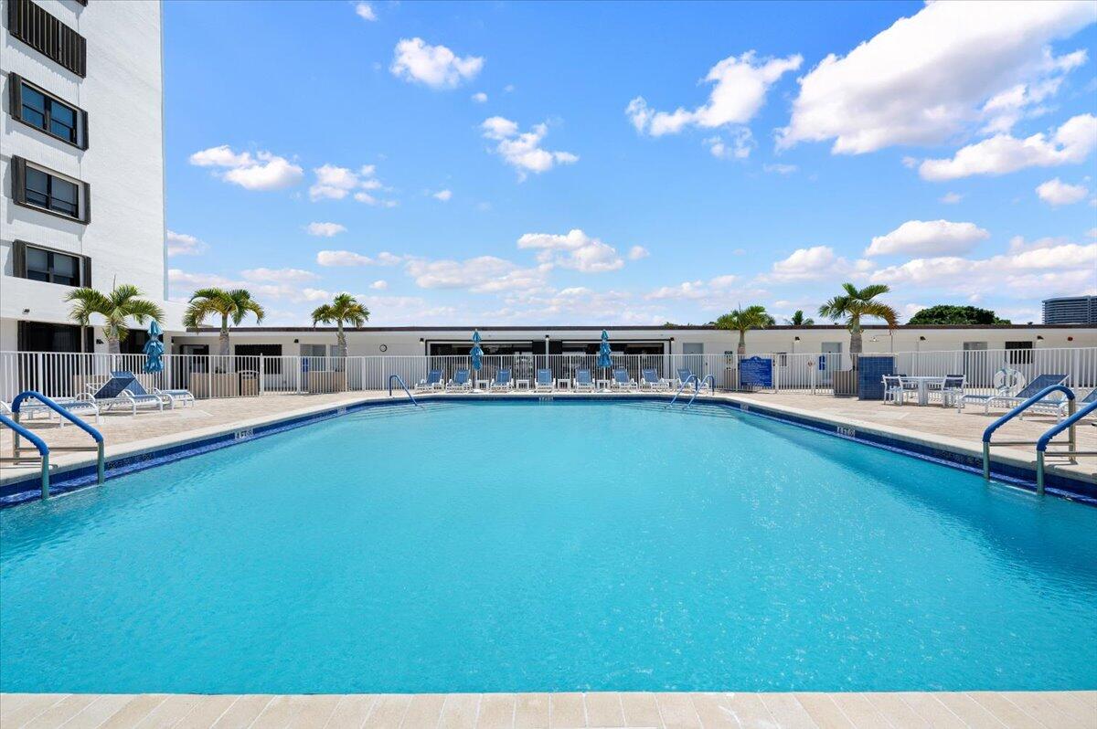 1200 Marine Way, Unit 304 North Palm Beach, FL 33408 - Photo 23 of 31 a view of a swimming pool with outdoor seating