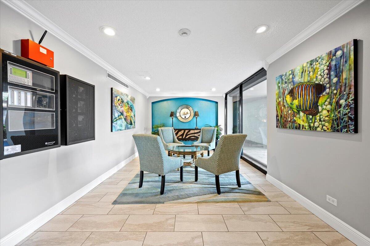 1200 Marine Way, Unit 304 North Palm Beach, FL 33408 - Photo 25 of 31 a view of a dining room with furniture a rug and a window