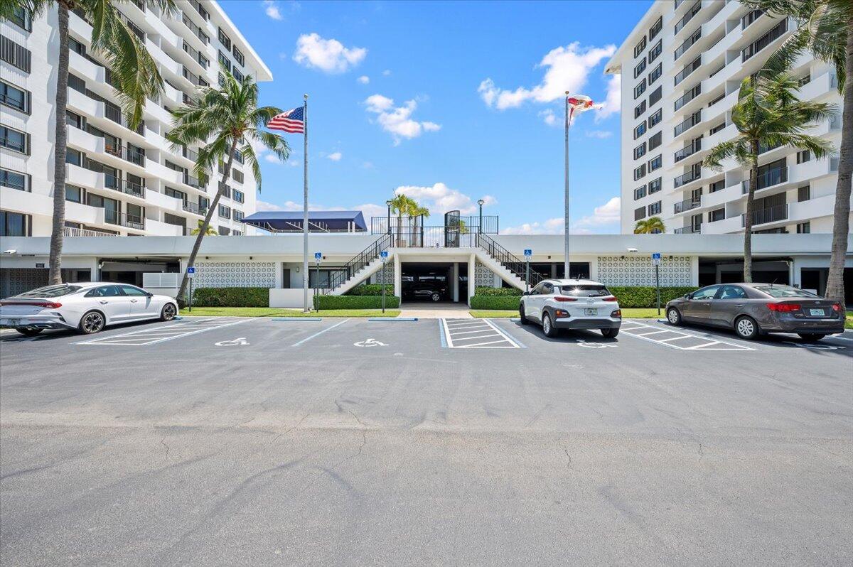 1200 Marine Way, Unit 304 North Palm Beach, FL 33408 - Photo 27 of 31 a building with cars parked in front of it