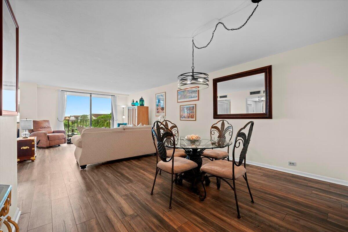 1200 Marine Way, Unit 304 North Palm Beach, FL 33408 - Photo 5 of 31 a living room with furniture and a wooden floor
