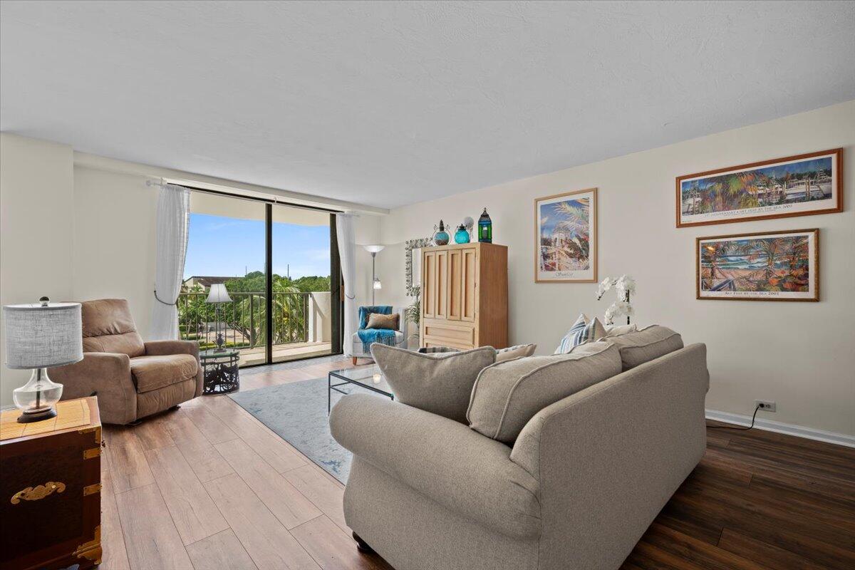 1200 Marine Way, Unit 304 North Palm Beach, FL 33408 - Photo 8 of 31 a living room with furniture and a large window