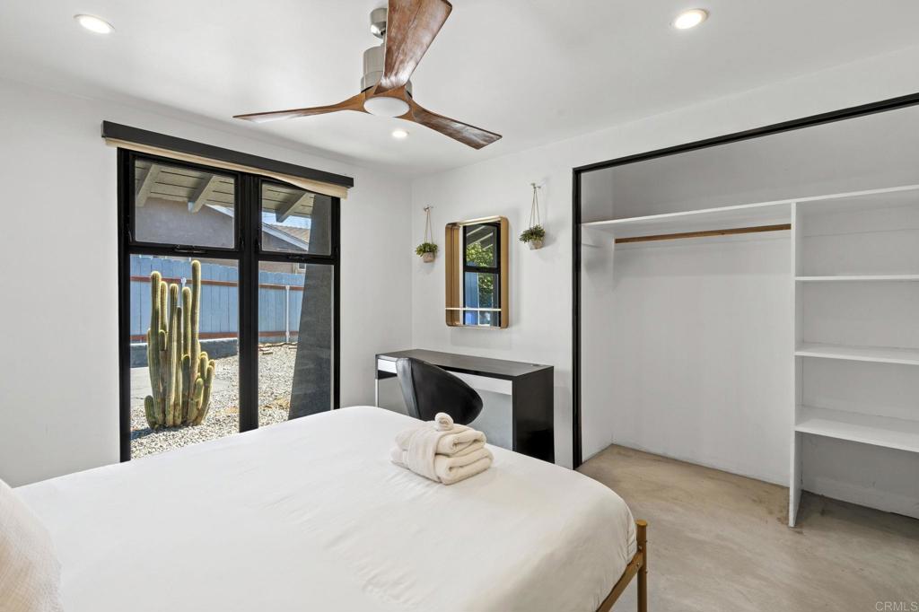 754 El Rancho Drive El Cajon, CA 92019 - Photo 29 of 55 a bedroom with a bed and lamp