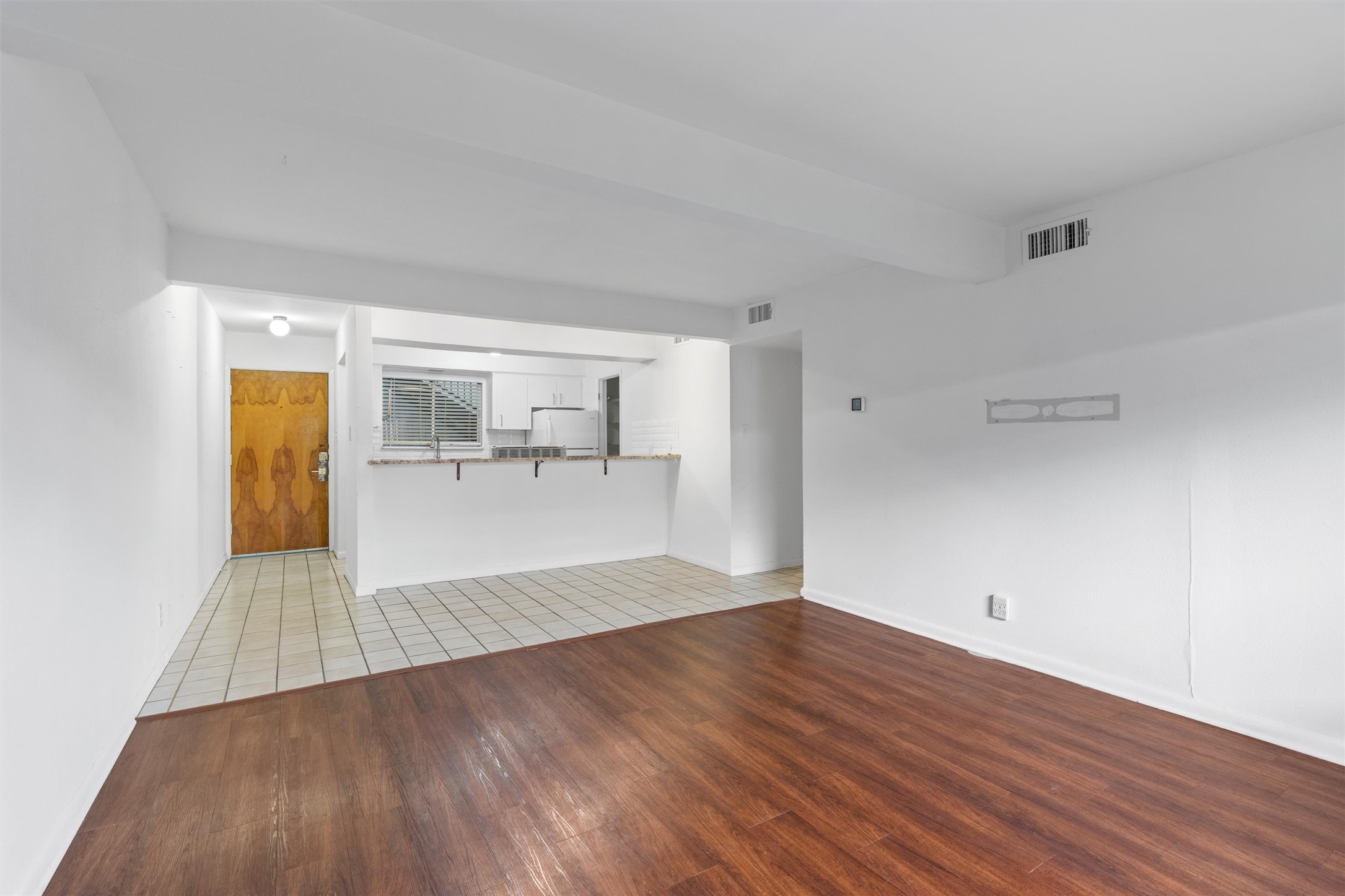 2208 Enfield Road, Unit 10500 Austin, TX 78703 - Photo 12 of 34 Spacious living area featuring wood-finish flooring