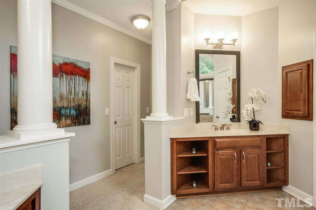 2109 CRIGAN Bluff Drive Cary, NC 27513 - Photo 19 of 30 a bathroom with a sink and a mirror