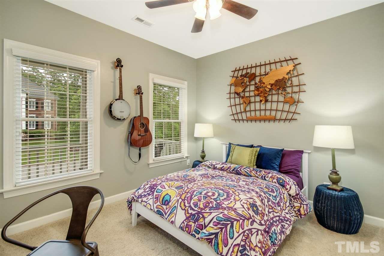 2109 CRIGAN Bluff Drive Cary, NC 27513 - Photo 23 of 30 a bedroom with a bed and a large window