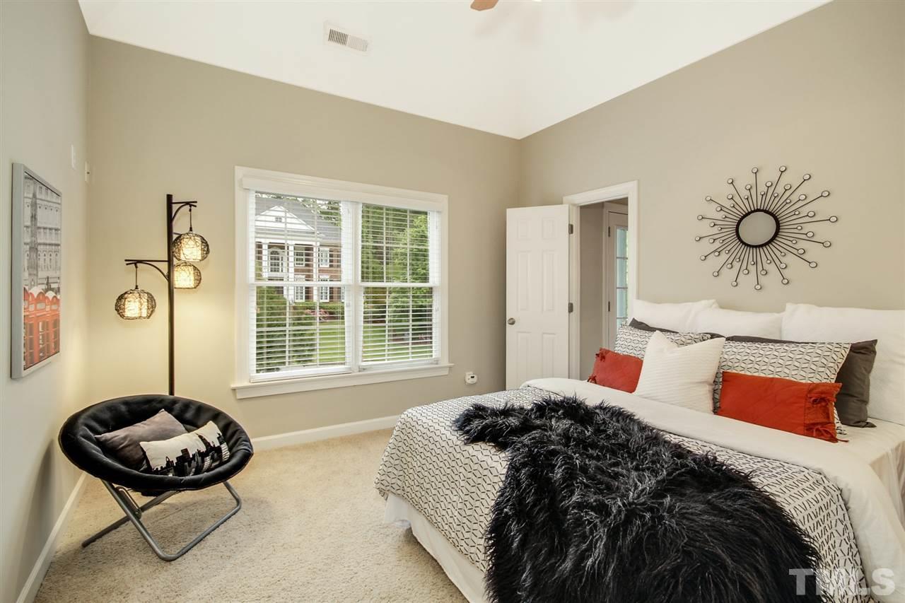 2109 CRIGAN Bluff Drive Cary, NC 27513 - Photo 24 of 30 a bedroom with a bed and a window