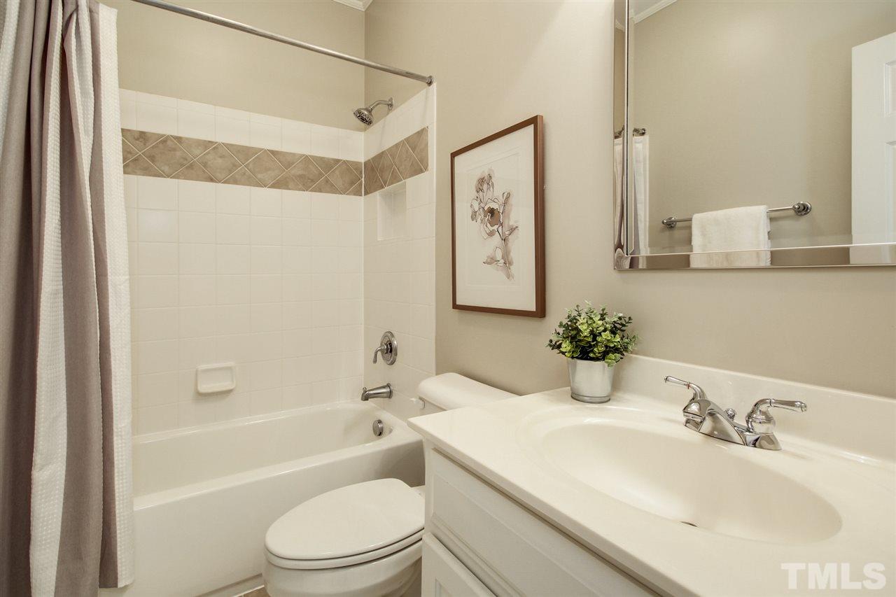 2109 CRIGAN Bluff Drive Cary, NC 27513 - Photo 25 of 30 a bathroom with a sink toilet and shower