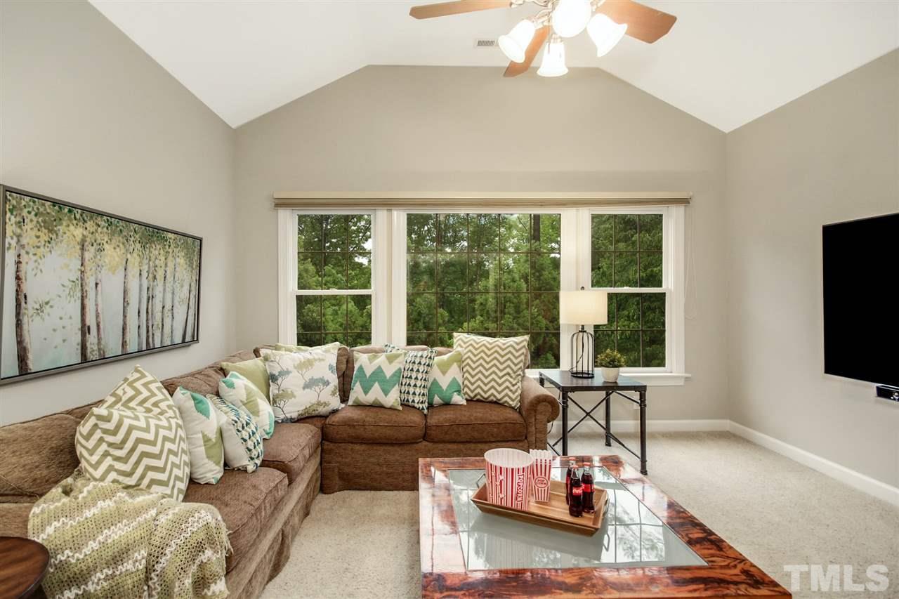 2109 CRIGAN Bluff Drive Cary, NC 27513 - Photo 26 of 30 a living room with furniture and a flat screen tv