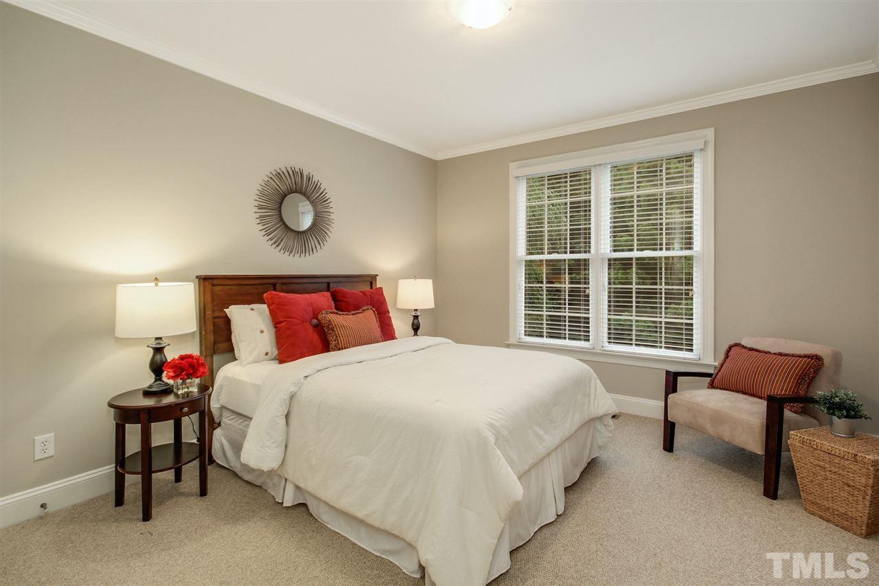 2109 CRIGAN Bluff Drive Cary, NC 27513 - Photo 27 of 30 a bedroom with a bed and a window