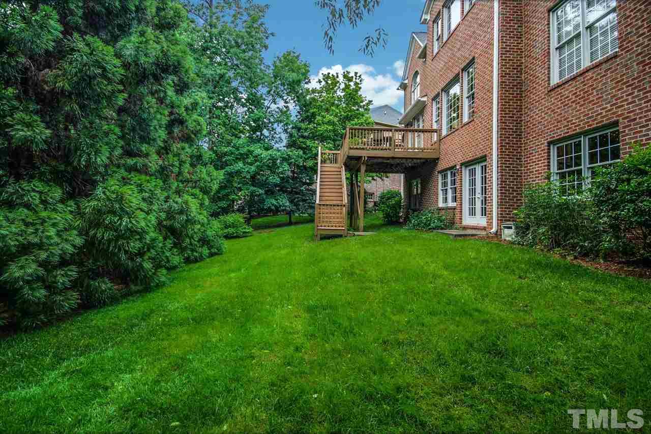 2109 CRIGAN Bluff Drive Cary, NC 27513 - Photo 29 of 30 a view of a building with a yard