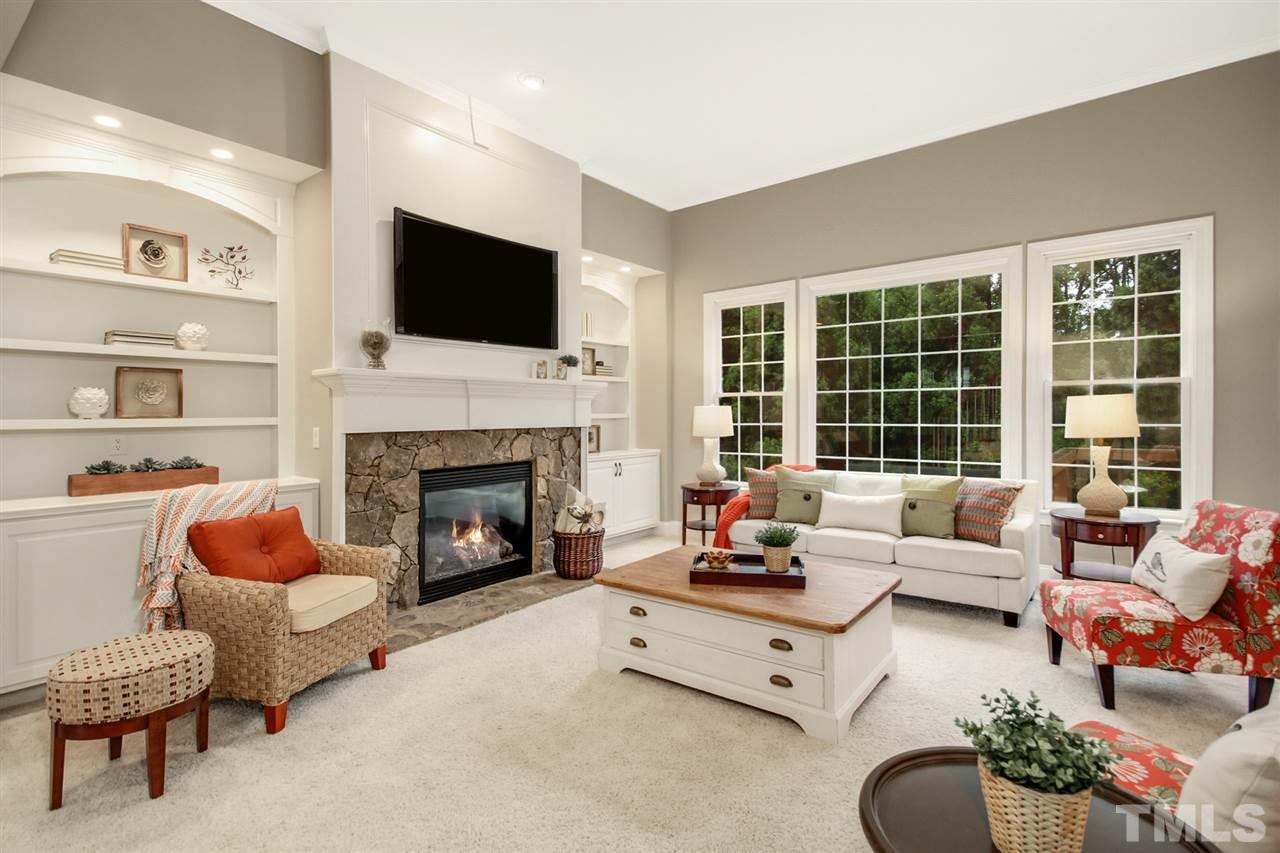 2109 CRIGAN Bluff Drive Cary, NC 27513 - Photo 8 of 30 a living room with furniture fireplace and flat screen tv