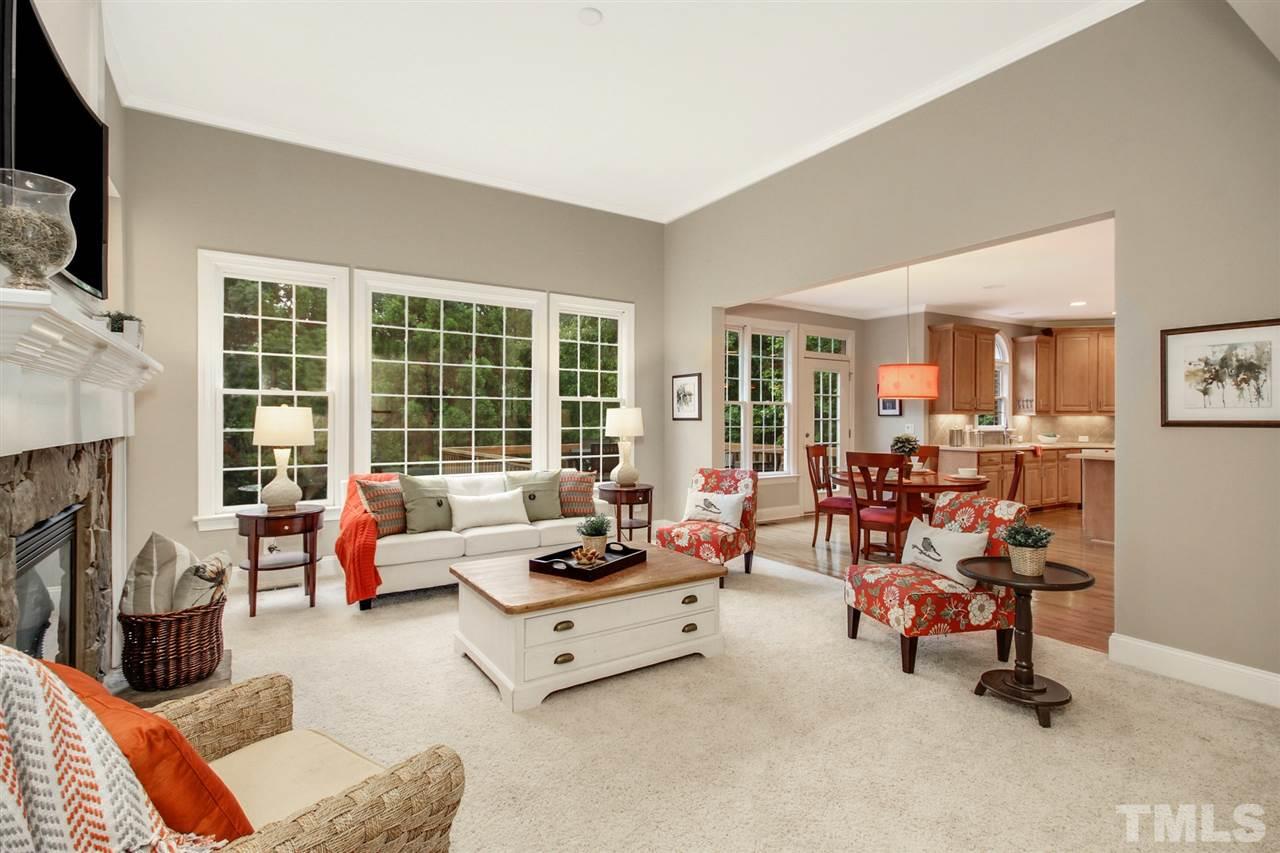 2109 CRIGAN Bluff Drive Cary, NC 27513 - Photo 9 of 30 a living room with furniture and a fireplace