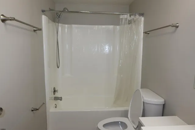 a swimming pool with lots of trees in the background