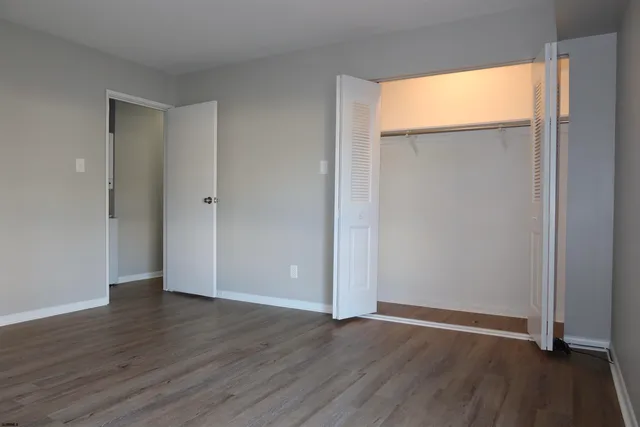 a view of a park with iron fence