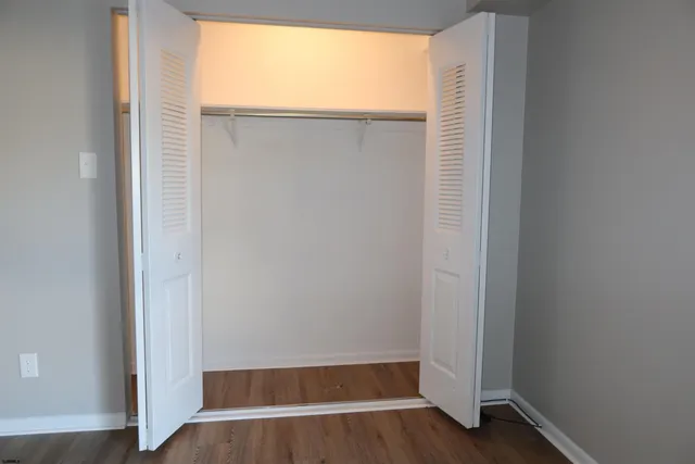 a view of a house with a yard and a fire pit