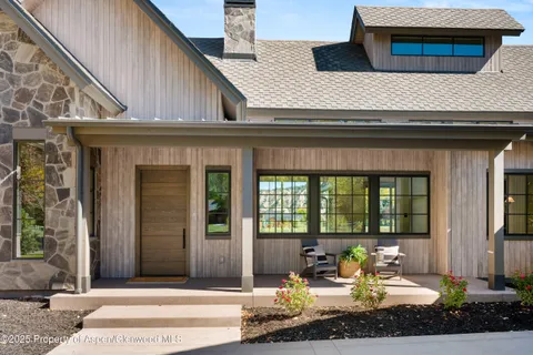 a front view of a house with patio