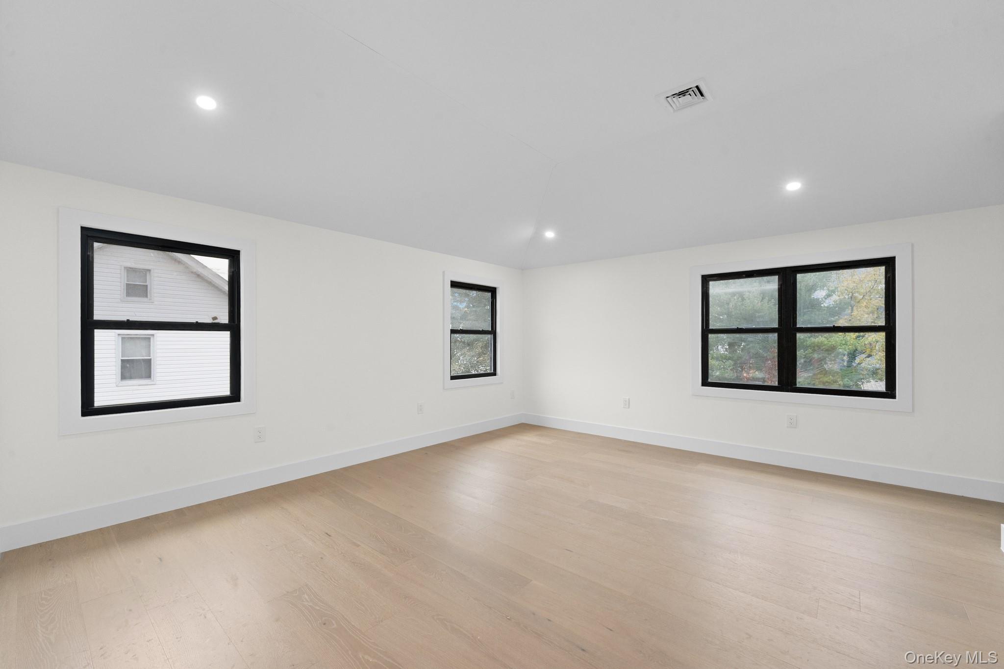 116-20 194th Street Queens, NY 11412 - Photo 20 of 27 Spare room with healthy amount of natural light, recessed lighting, and light wood-style floors