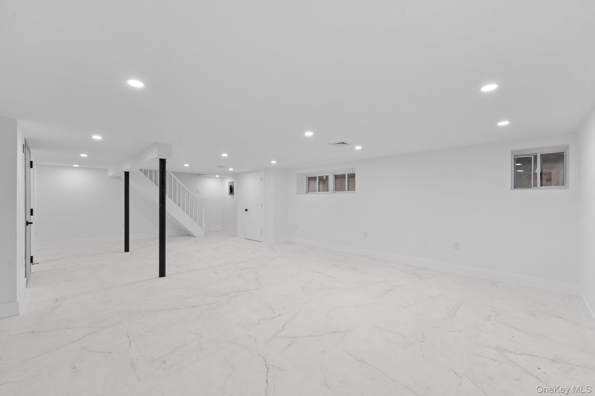 116-20 194th Street Queens, NY 11412 - Photo 23 of 27 Finished basement featuring recessed lighting and stairs