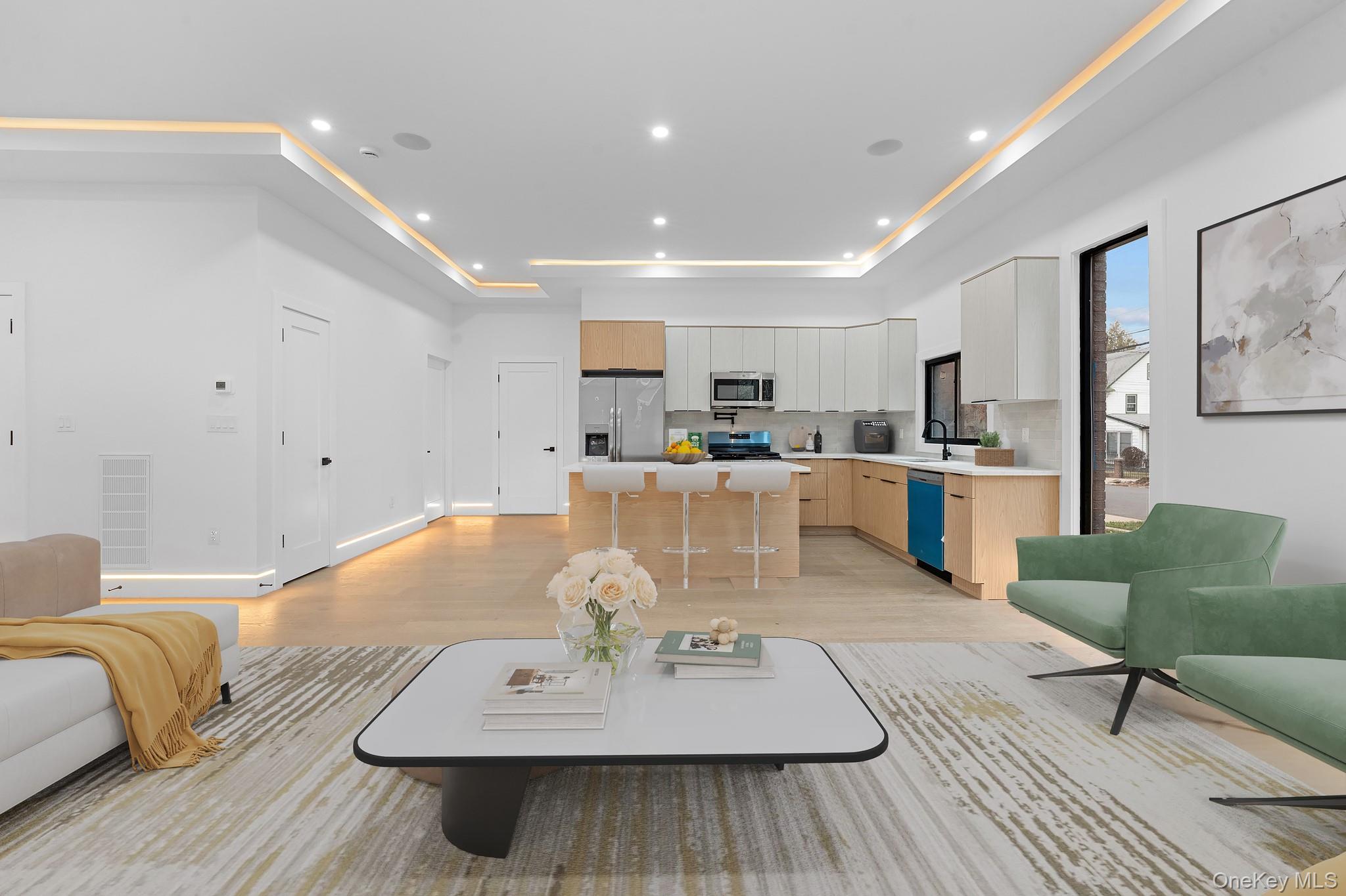 116-20 194th Street Queens, NY 11412 - Photo 3 of 27 Living room with recessed lighting, light wood finished floors, and a tray ceiling