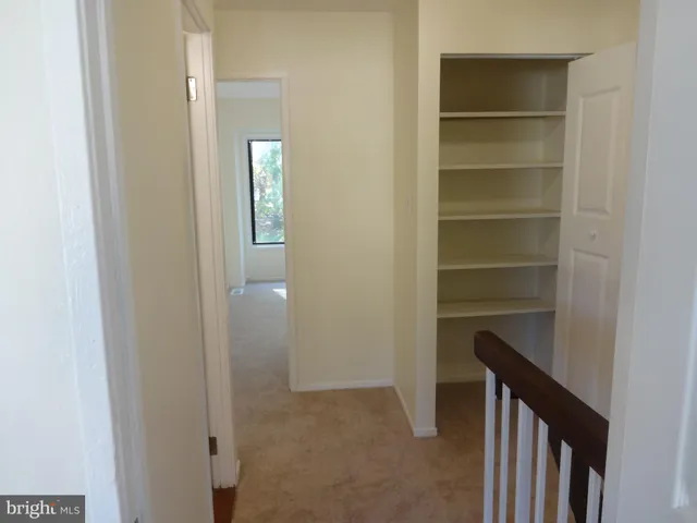 a view of a hallway with closet