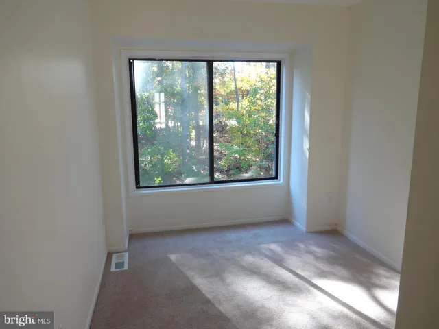 en empty room with large windows