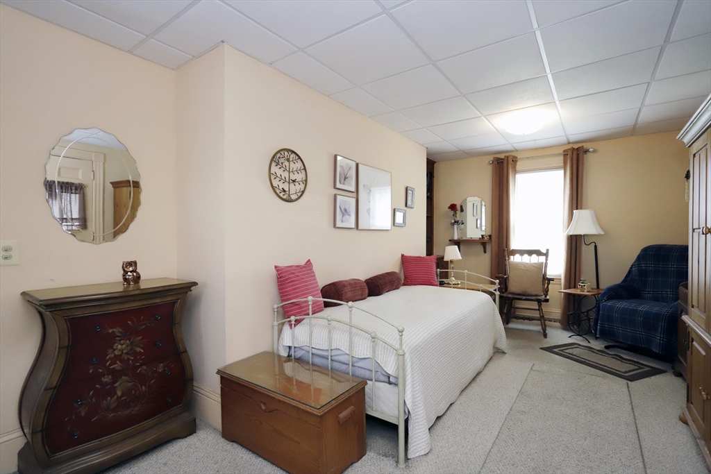 5 Anthony Street Acushnet, MA 02743 - Photo 14 of 37 a bedroom with a bed couch and a window