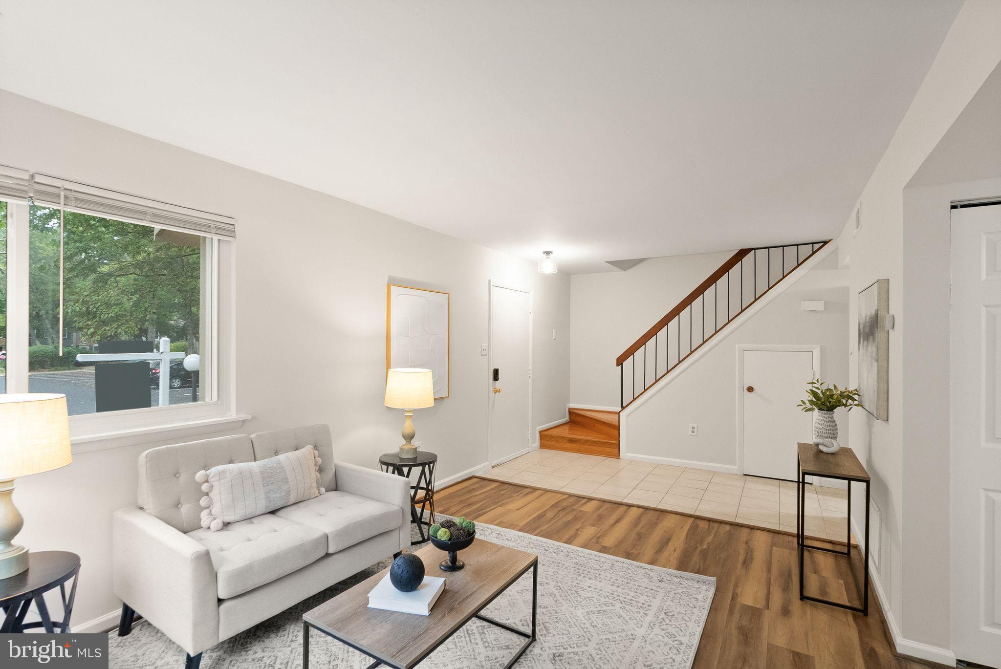 10679 Spring Oak Court Burke, VA 22015 - Photo 11 of 42 a living room with furniture and wooden floor