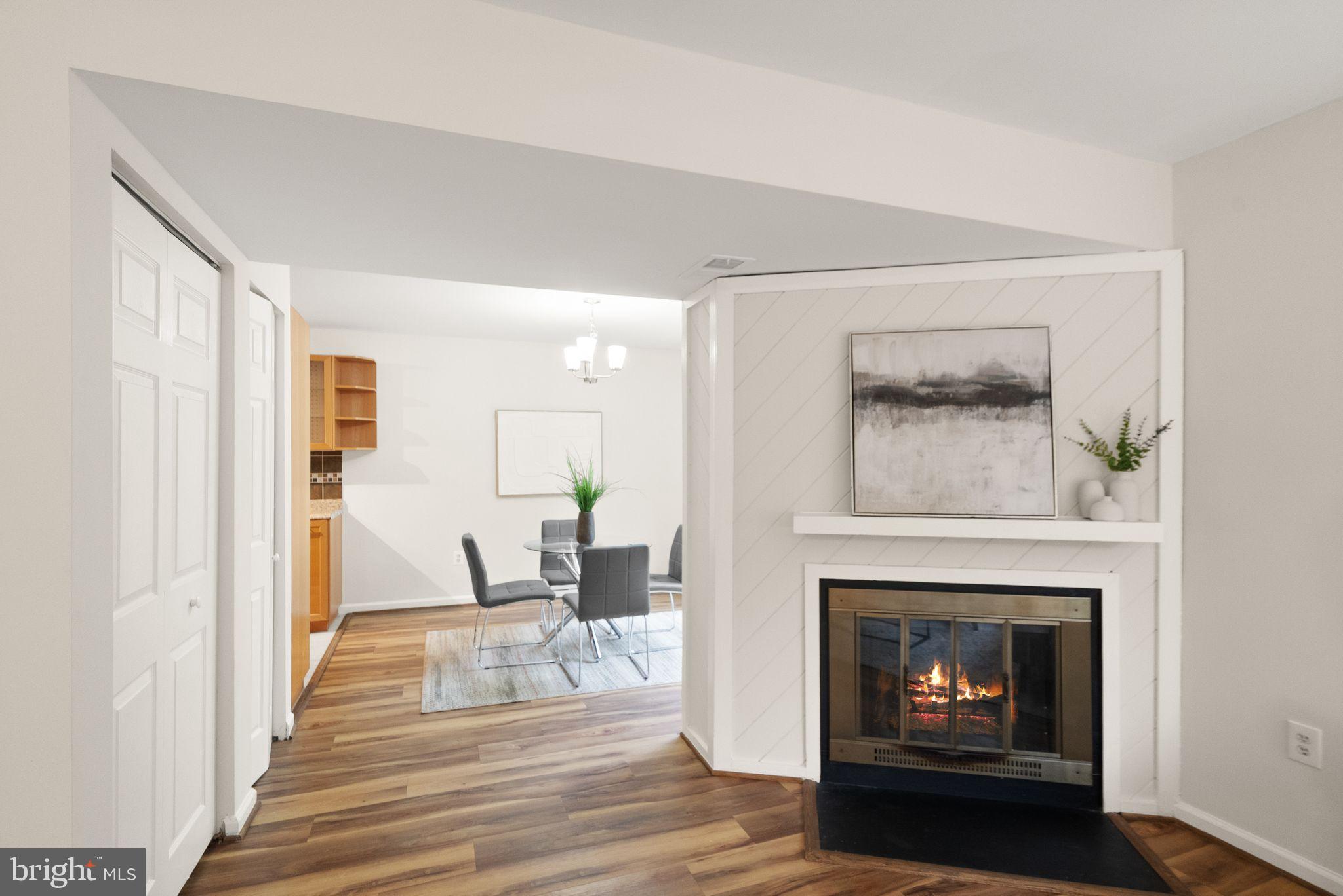 10679 Spring Oak Court Burke, VA 22015 - Photo 13 of 42 a living room with furniture and a fireplace