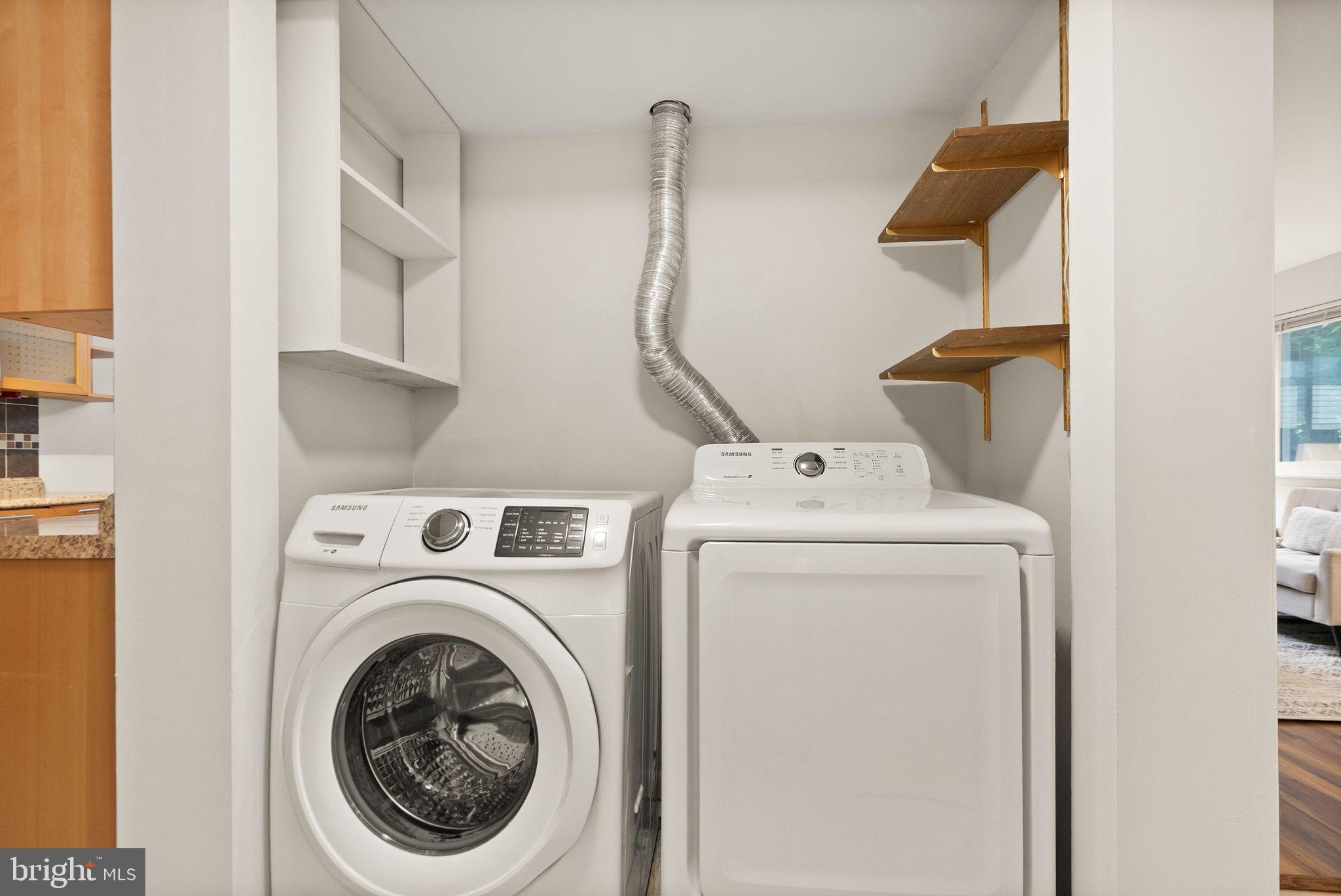 10679 Spring Oak Court Burke, VA 22015 - Photo 22 of 42 a utility room with dryer and washer