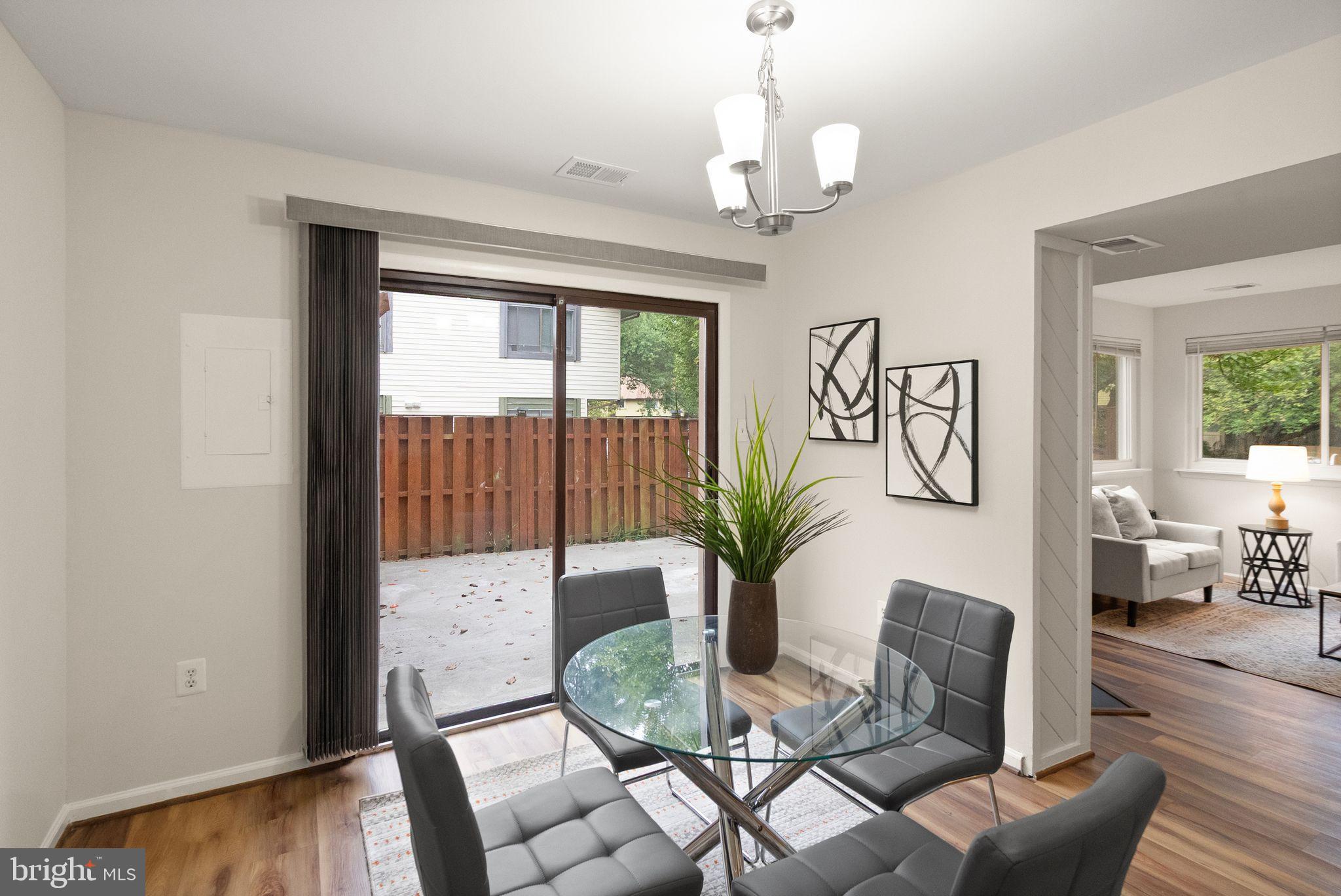 10679 Spring Oak Court Burke, VA 22015 - Photo 5 of 42 a living room with furniture potted plant and a large window