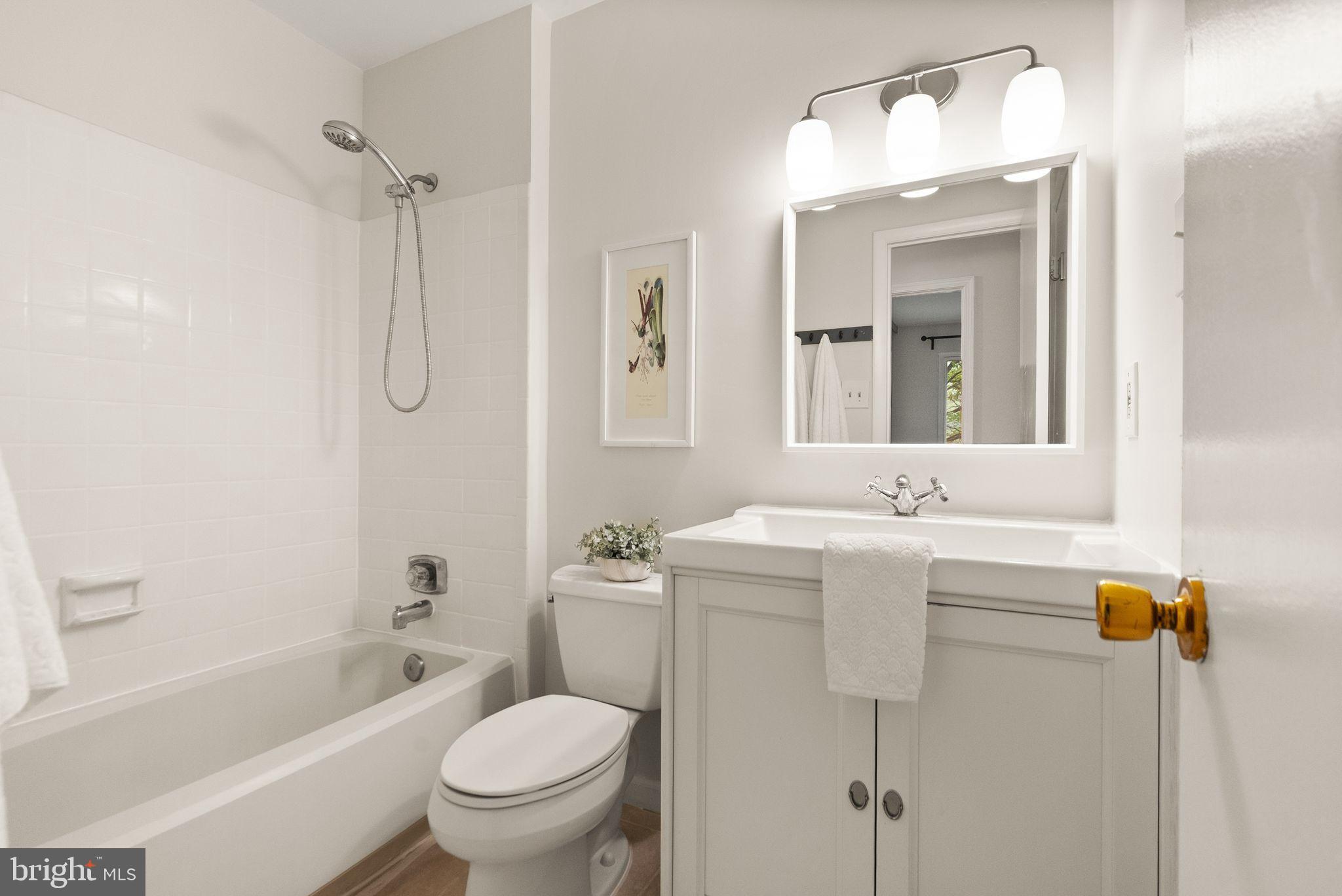 10679 Spring Oak Court Burke, VA 22015 - Photo 7 of 42 a bathroom with a sink toilet and shower