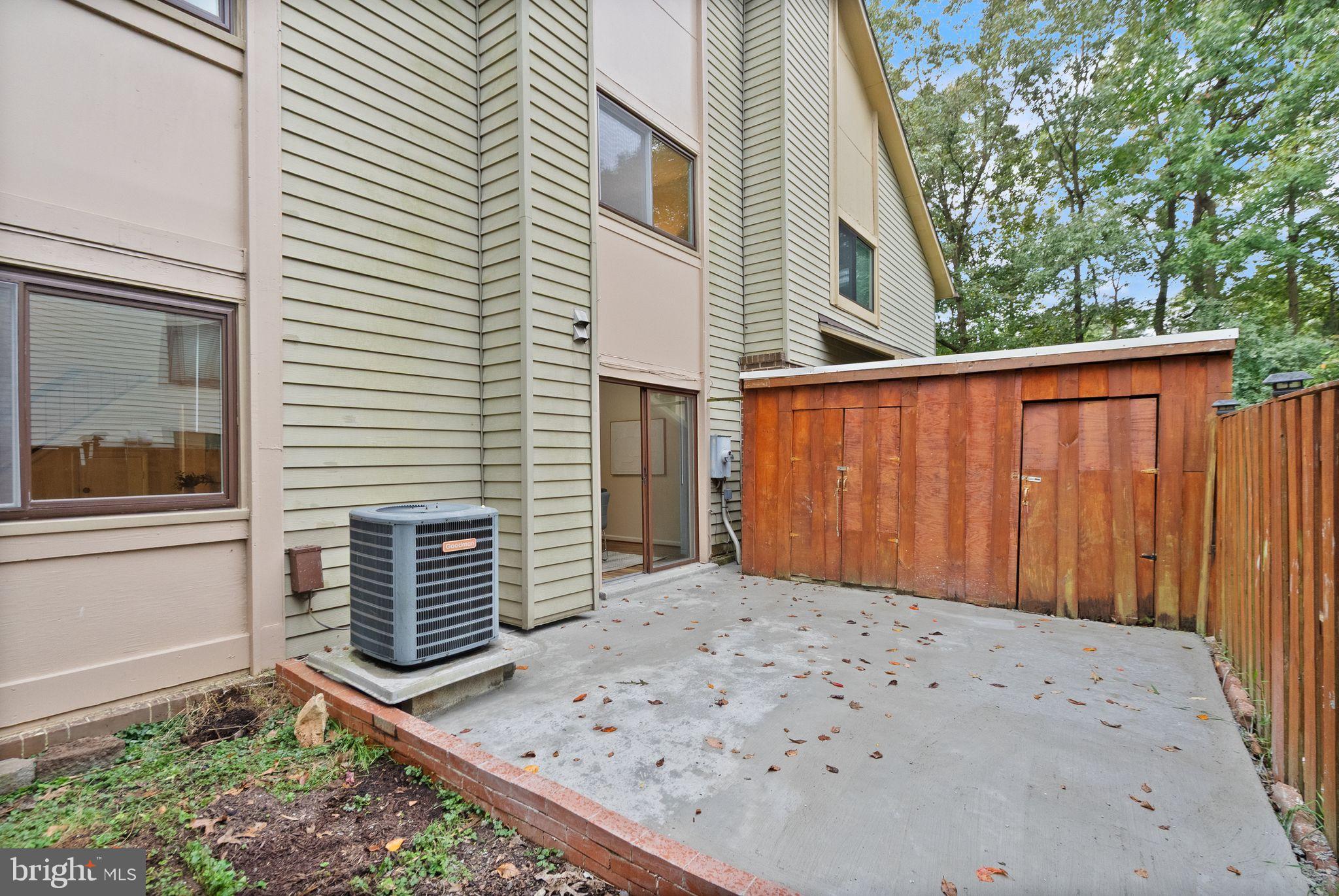 10679 Spring Oak Court Burke, VA 22015 - Photo 8 of 42 a view of a backyard with a large tree