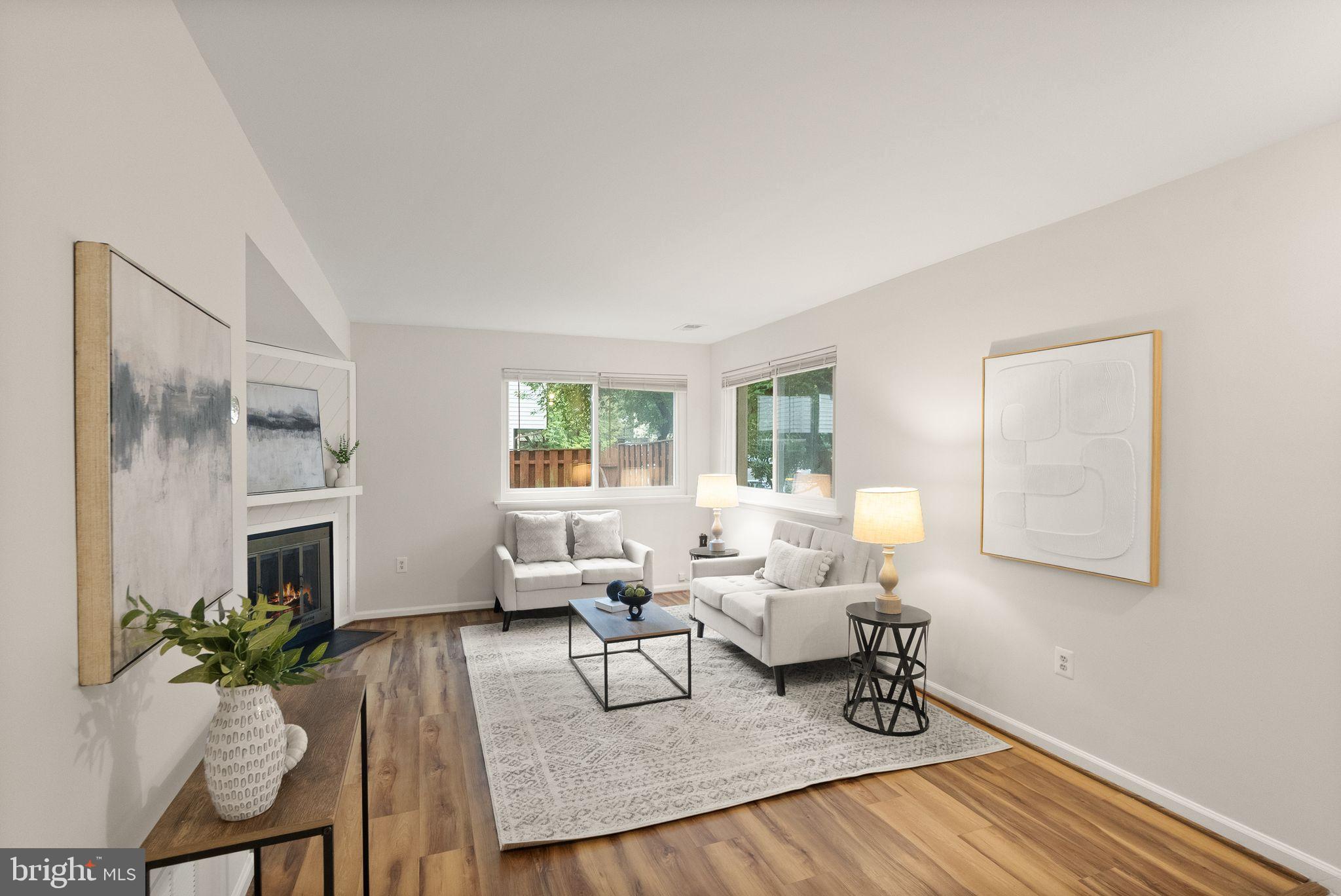 10679 Spring Oak Court Burke, VA 22015 - Photo 10 of 42 a living room with furniture and wooden floor