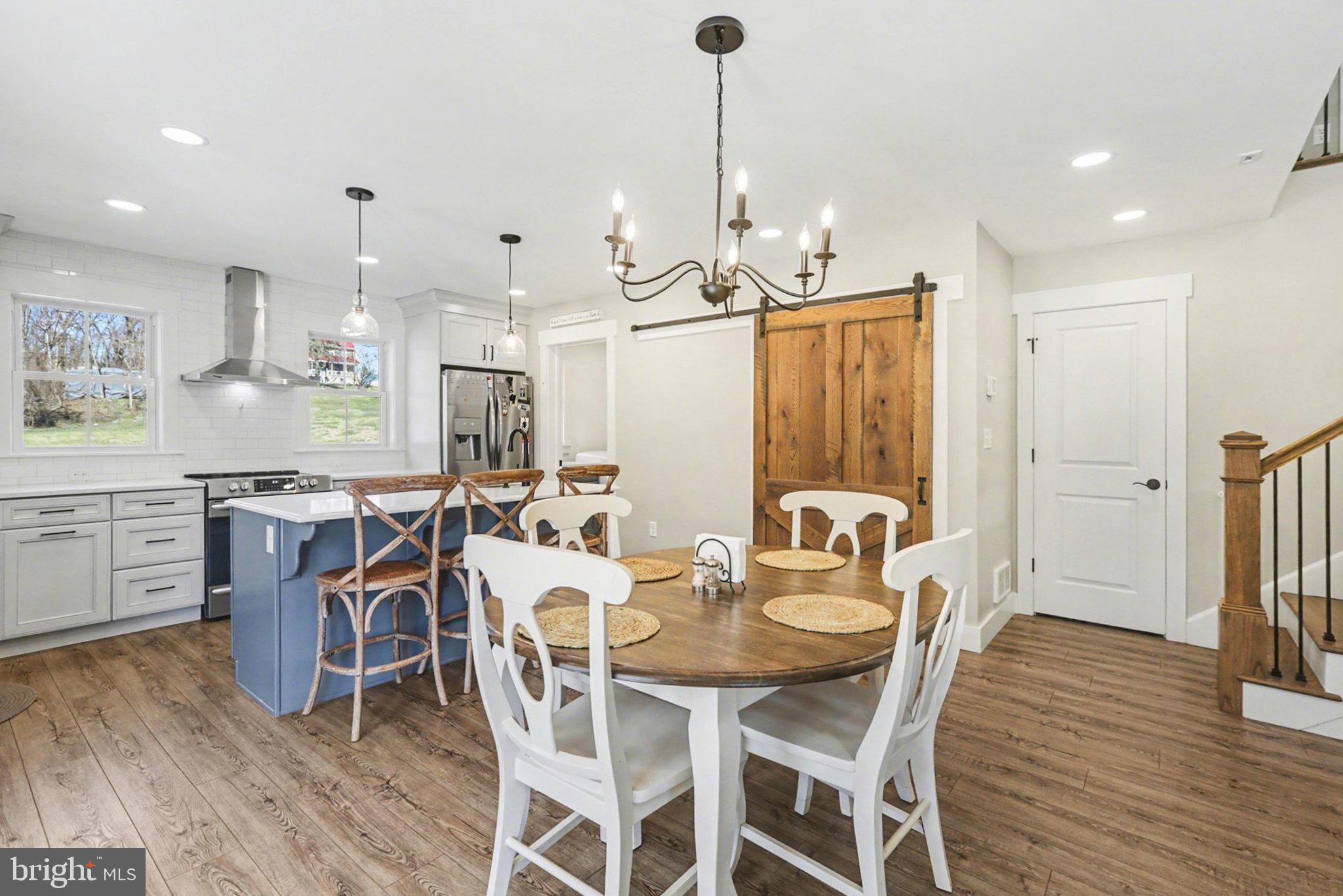 545 Pleasant View Road Lewisberry, PA 17339 - Photo 11 of 62 a view of a dining room and livingroom with furniture wooden floor a chandelier