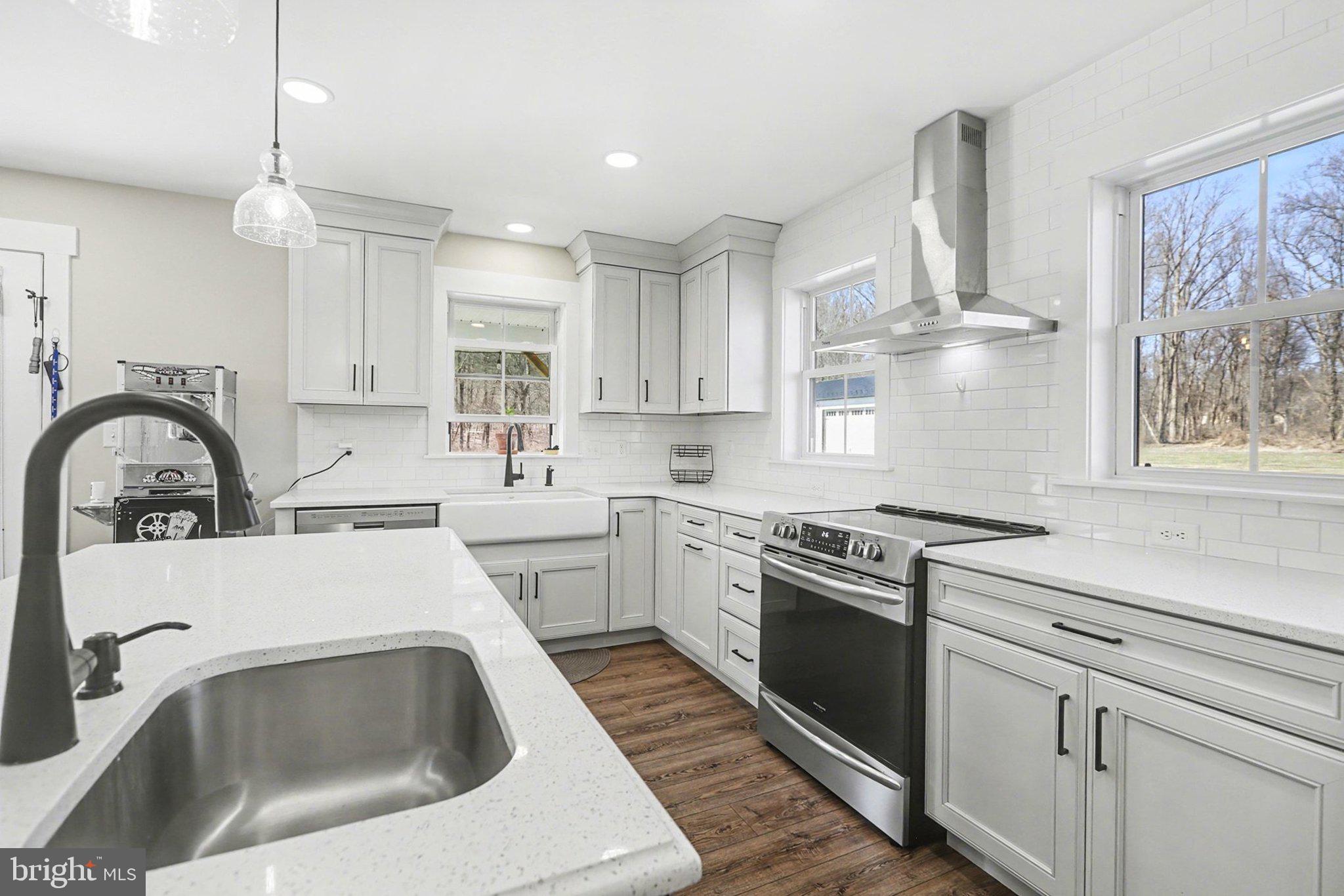 545 Pleasant View Road Lewisberry, PA 17339 - Photo 13 of 62 a kitchen with a stove a sink and a microwave