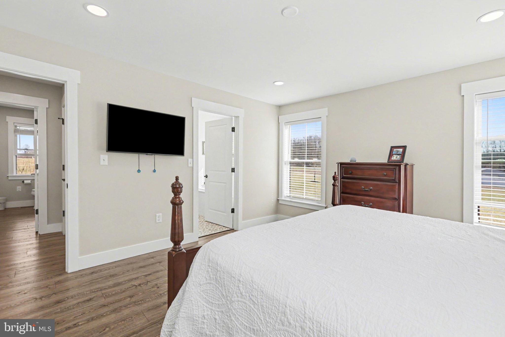 545 Pleasant View Road Lewisberry, PA 17339 - Photo 20 of 62 a bedroom with a bed and a flat screen tv