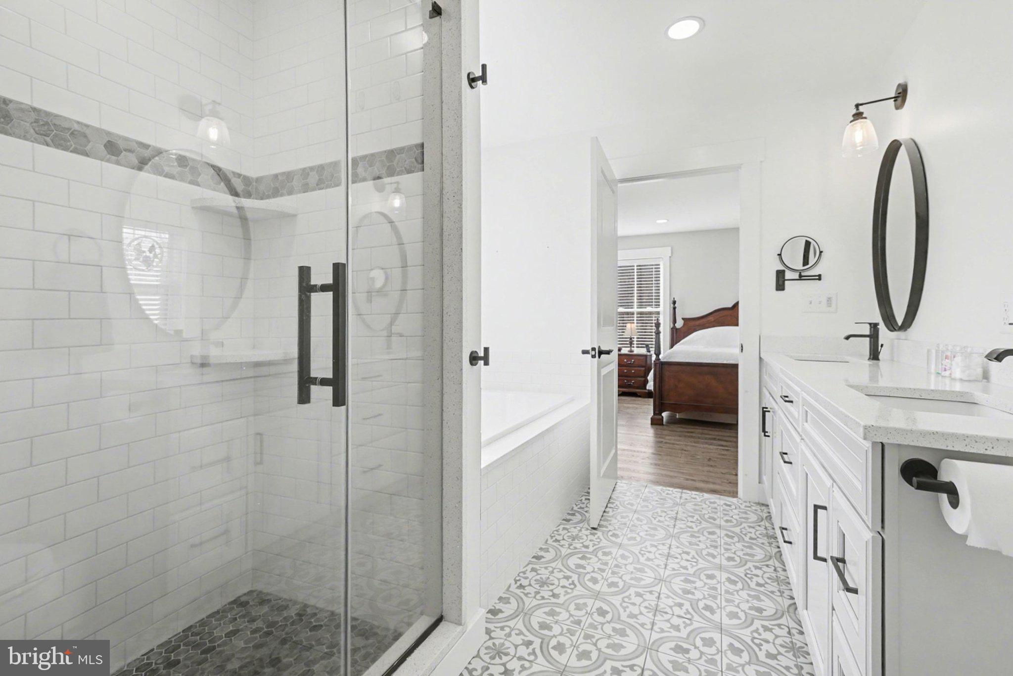 545 Pleasant View Road Lewisberry, PA 17339 - Photo 23 of 62 a en suite bathroom with a double vanity sink a mirror and a shower