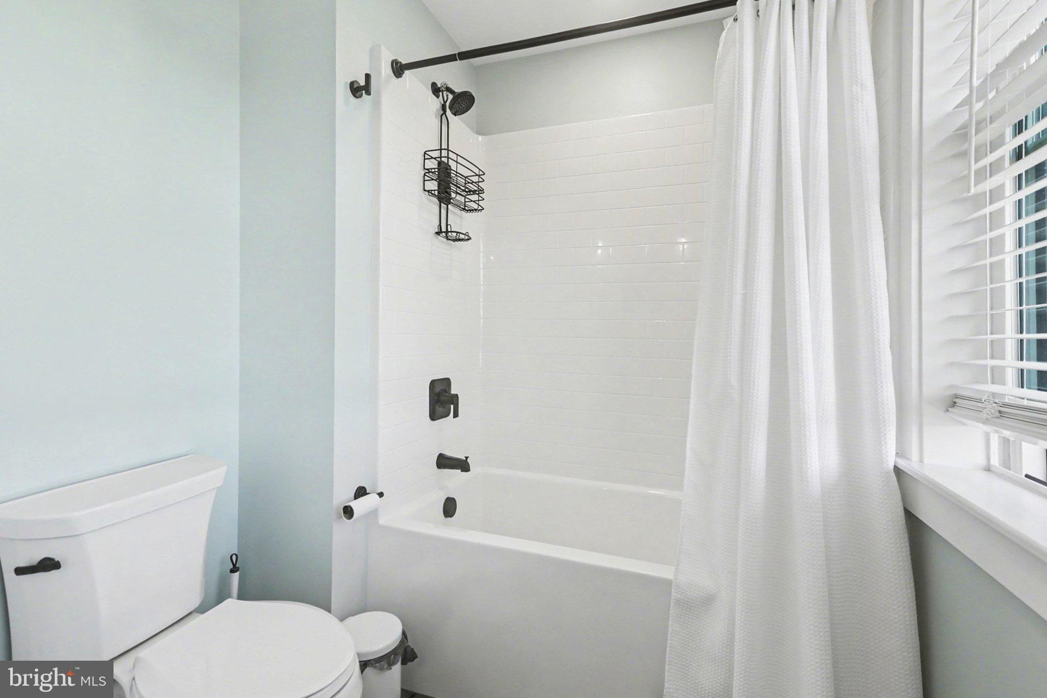 545 Pleasant View Road Lewisberry, PA 17339 - Photo 32 of 62 a white toilet sitting next to a bath tub