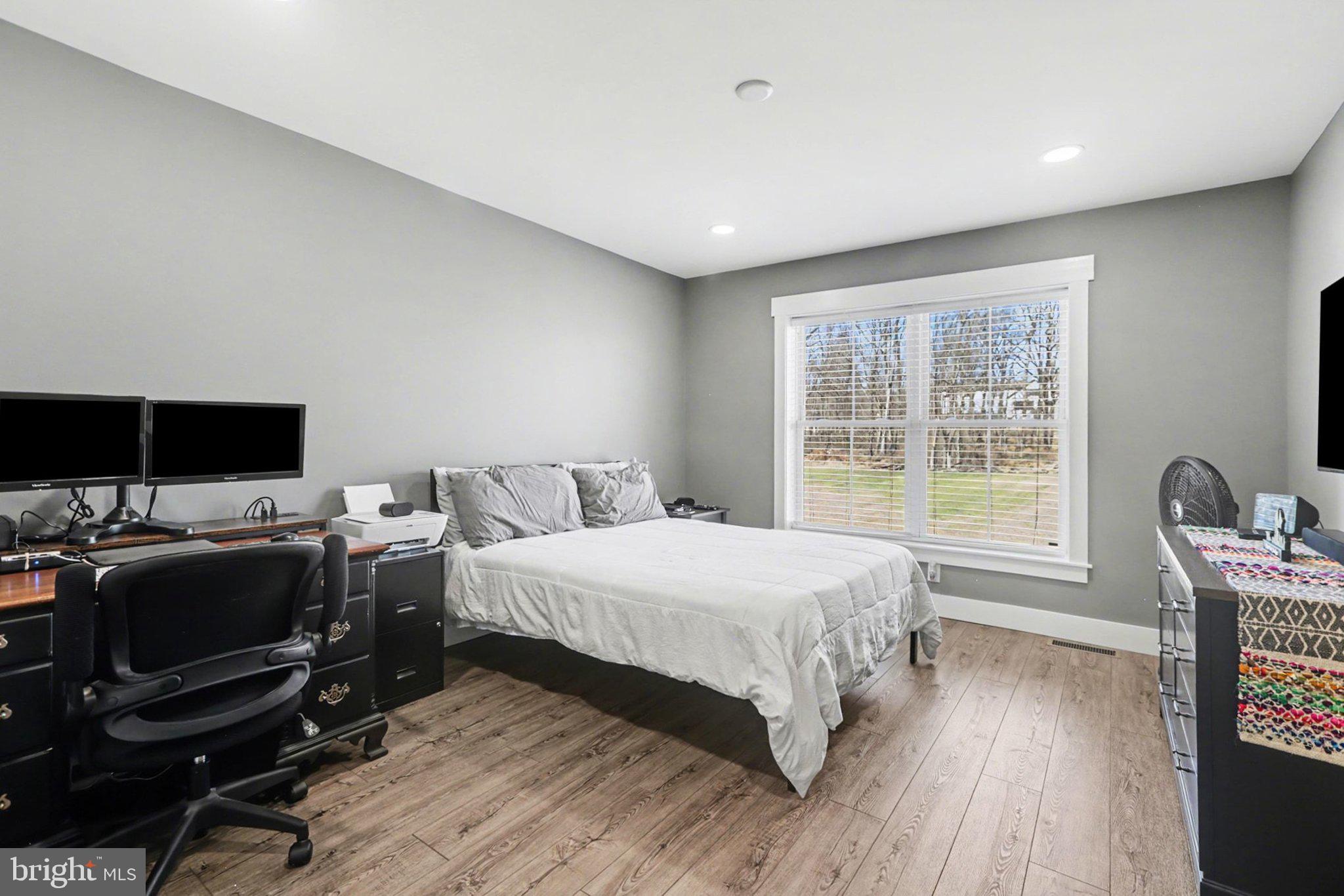 545 Pleasant View Road Lewisberry, PA 17339 - Photo 34 of 62 a bedroom with a bed and a flat screen tv