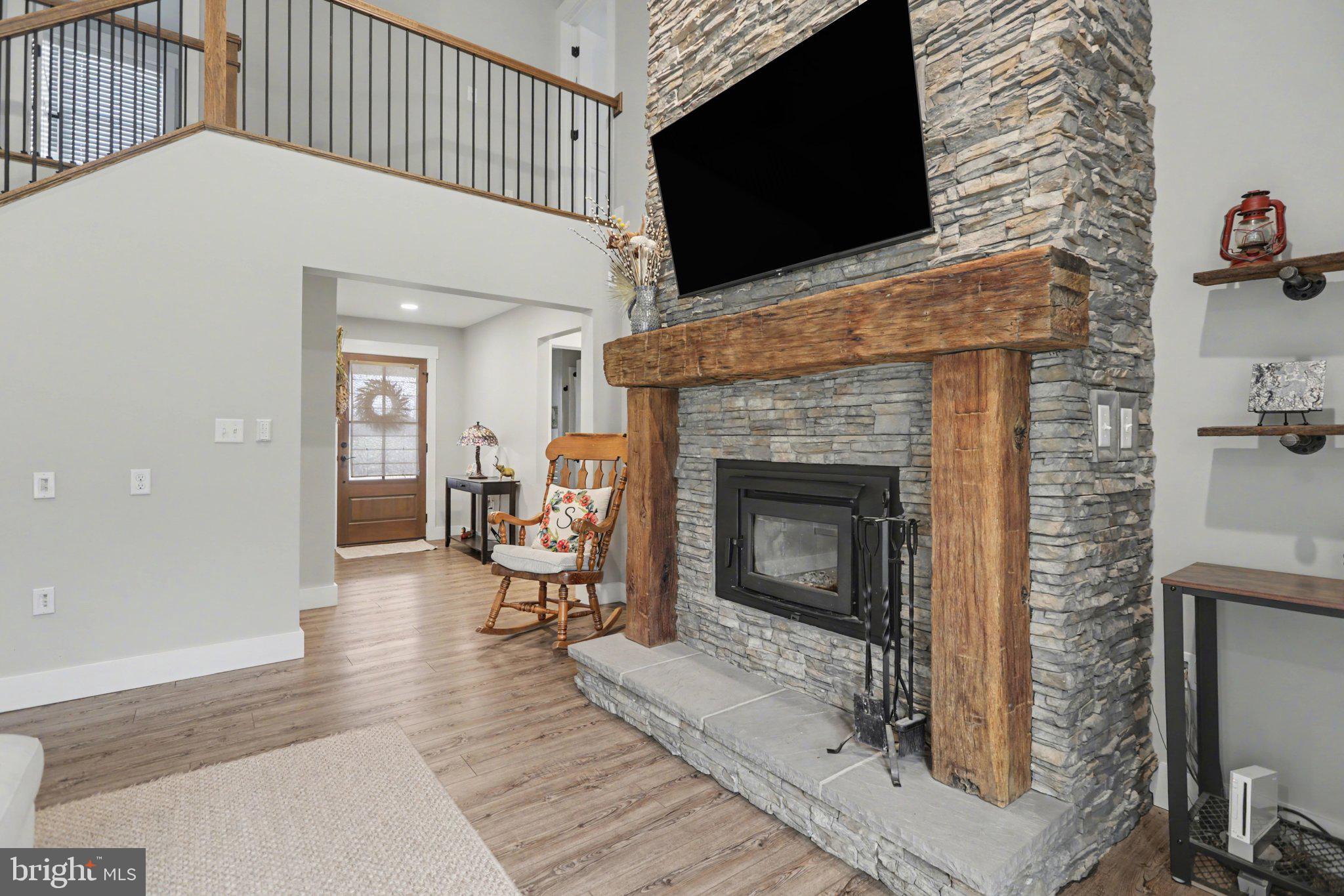 545 Pleasant View Road Lewisberry, PA 17339 - Photo 9 of 62 a living room with furniture a flat screen tv and a fireplace
