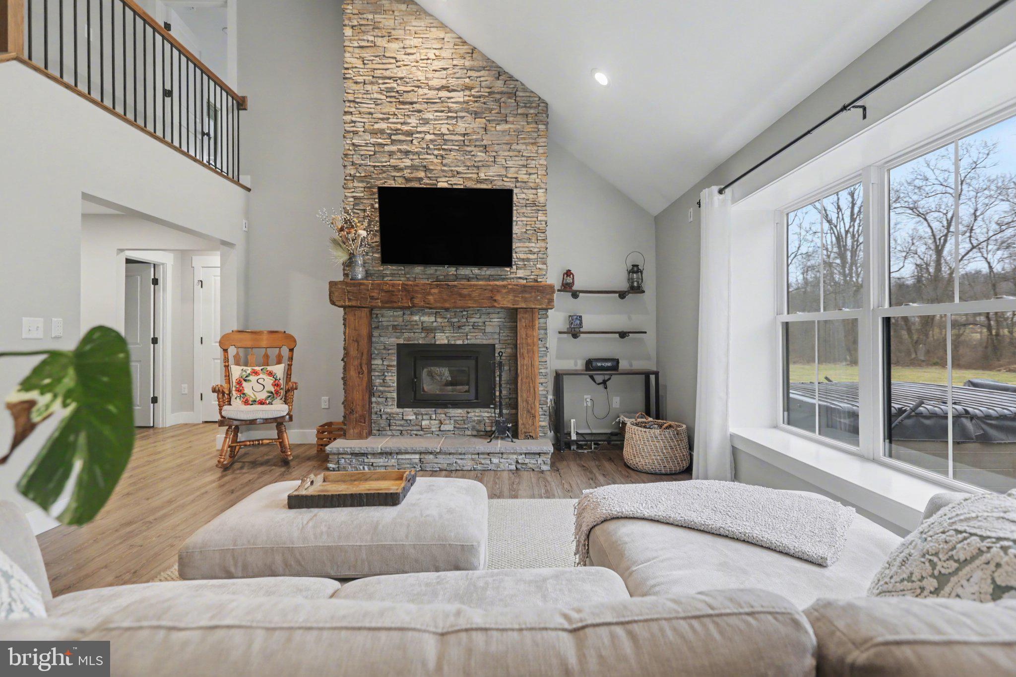 545 Pleasant View Road Lewisberry, PA 17339 - Photo 10 of 62 a living room with furniture a flat screen tv and a fireplace